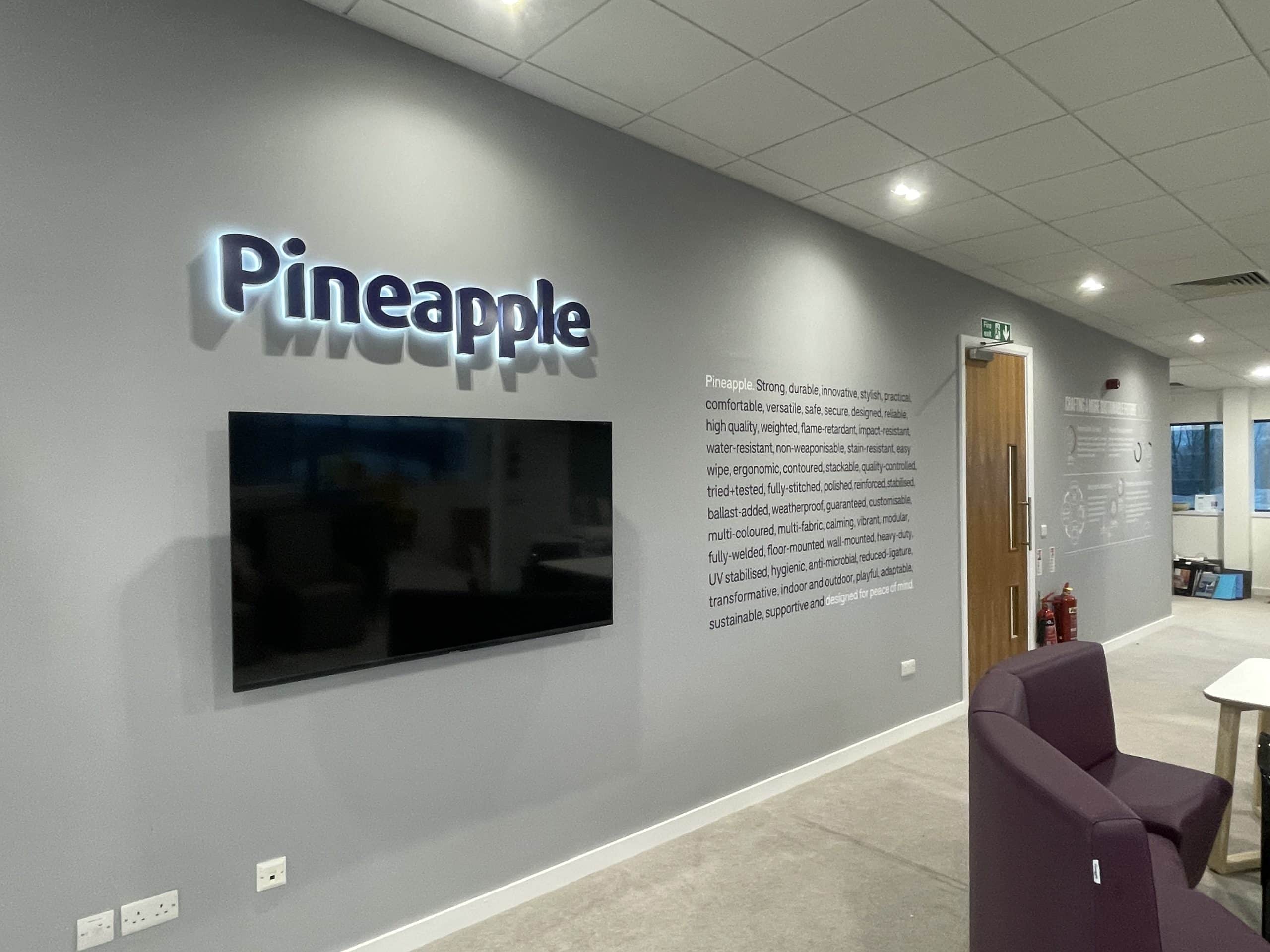 A sign that says "pineapple office"