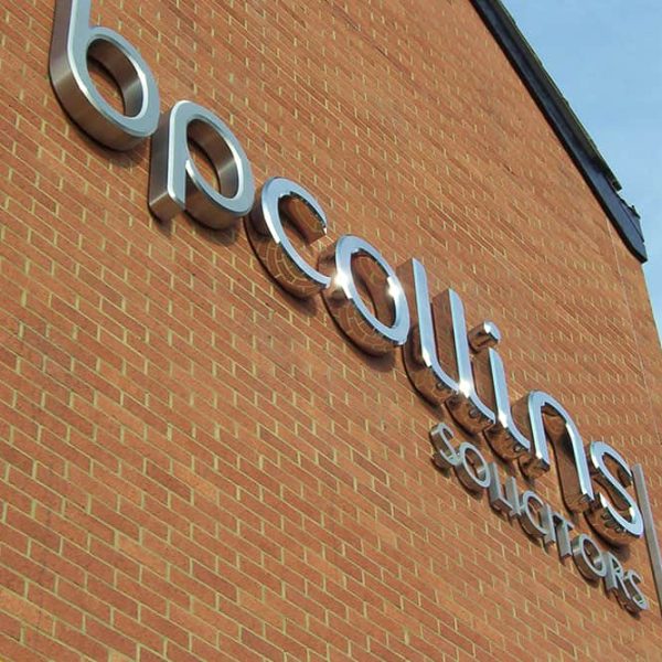 sign-makers-uk-external-signs-7-2 A brick building with a sign "bpcollins".